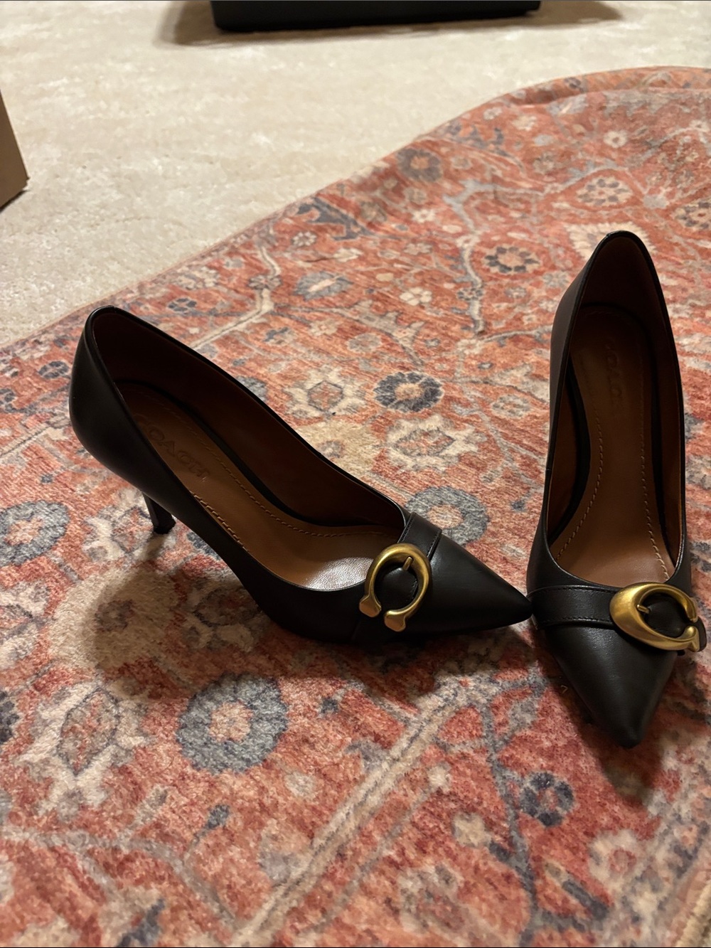 Coach Black Pointed-Toe Leather Pumps with Gold Buckle